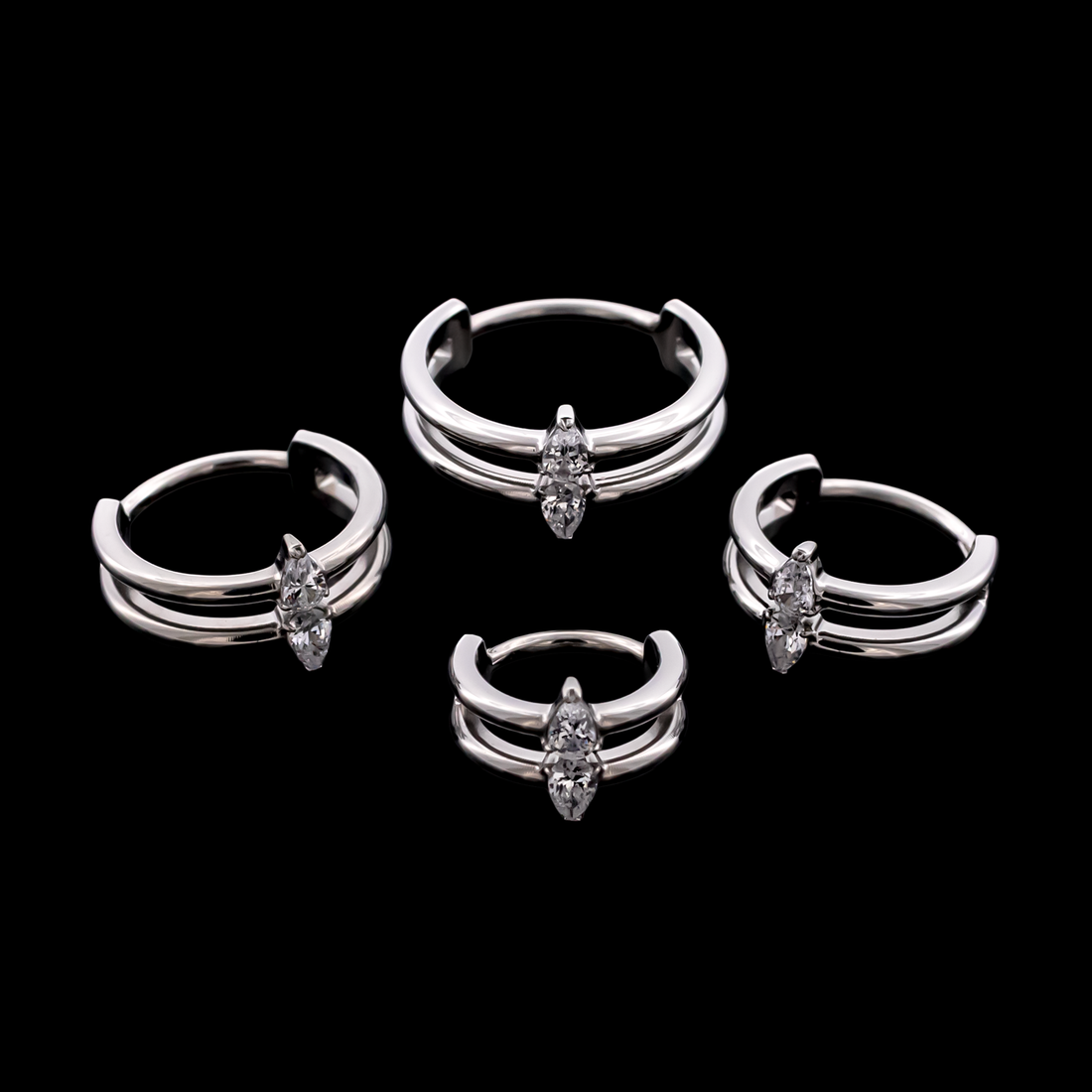 Blair- titanium hinged rings on black ground