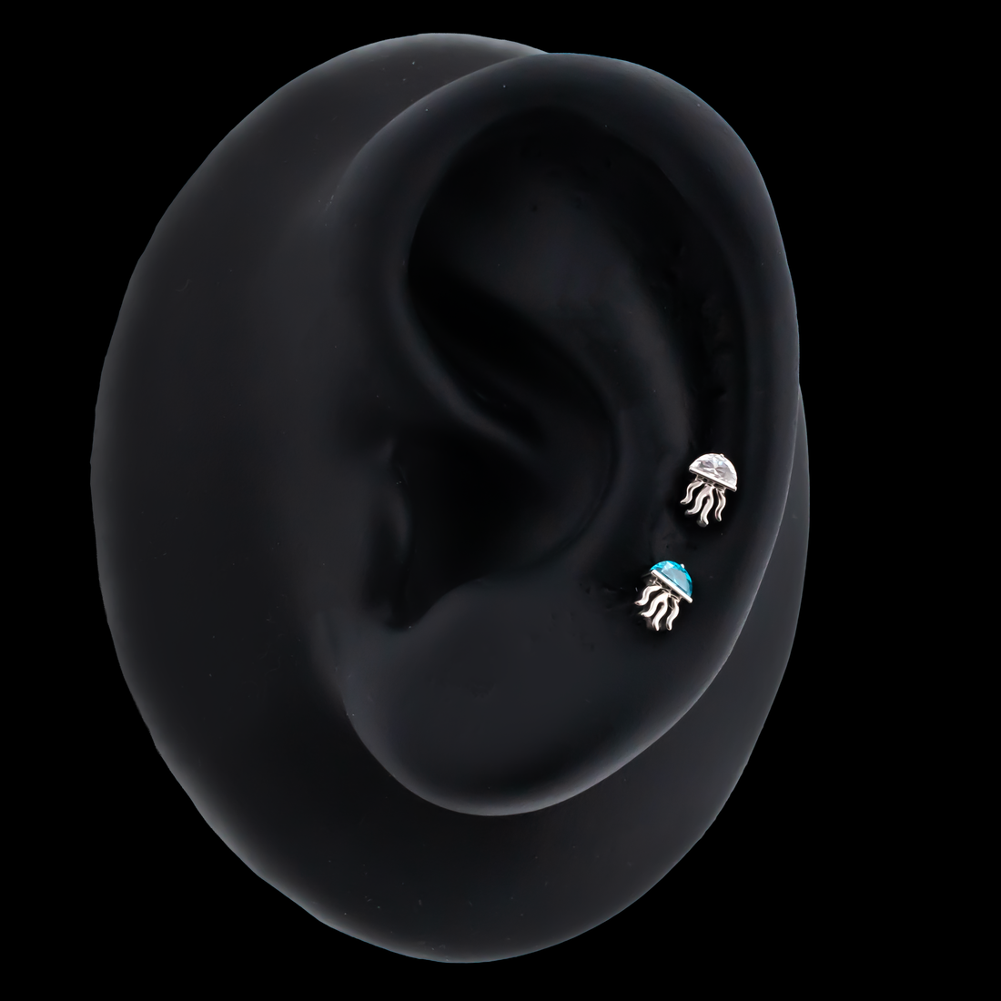 jellyfish replacement ends with gem accents on black silicone ear