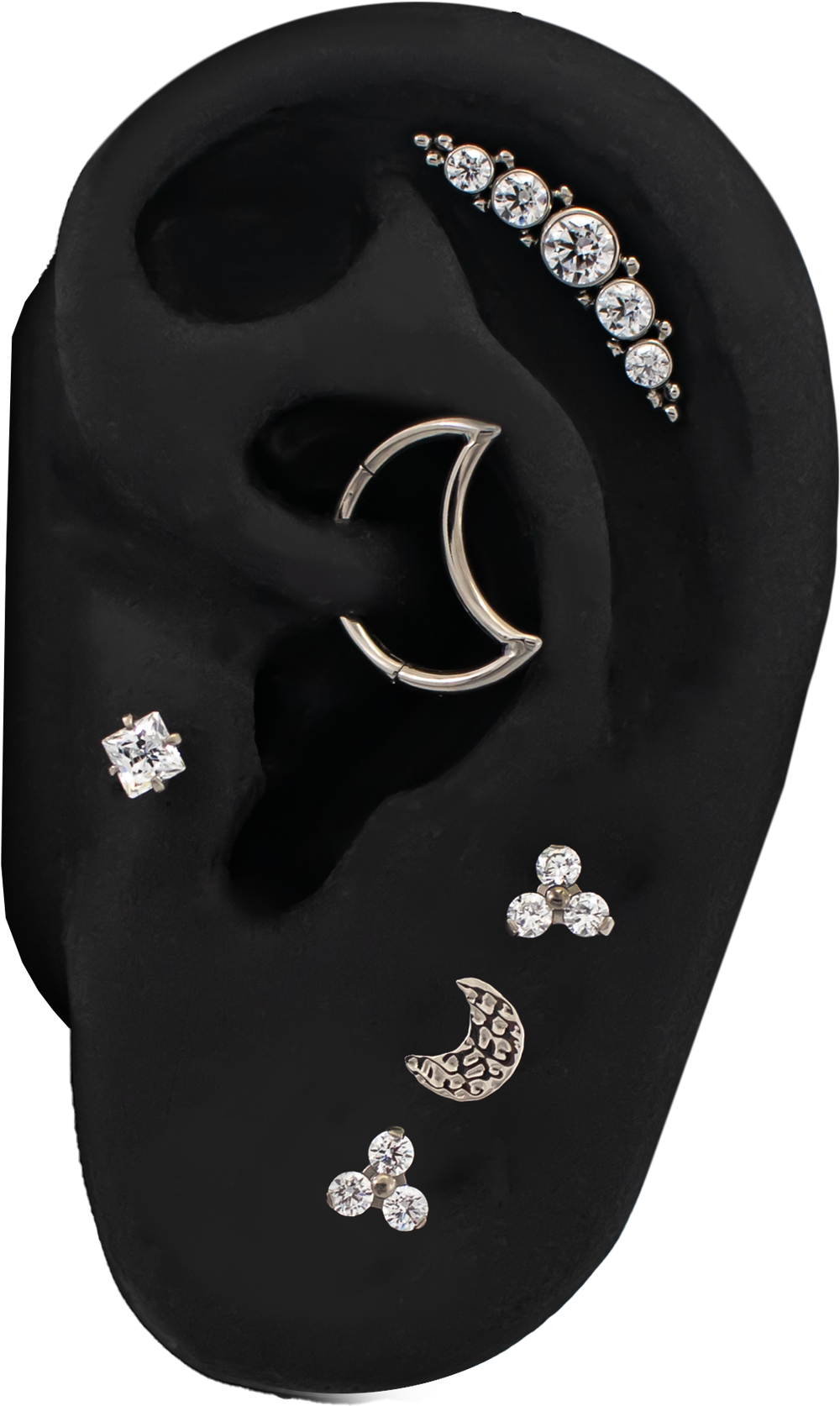 titanium ear curation on a black silicone ear