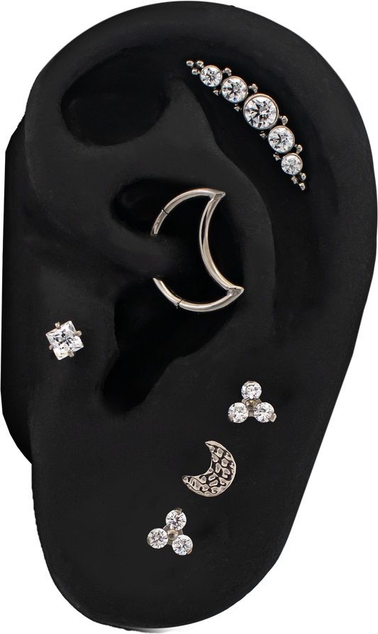 titanium ear curation on a black silicone ear